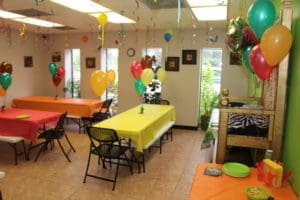 An overview photo of the Kicky & Tink's Playhouse jungle-themed party room