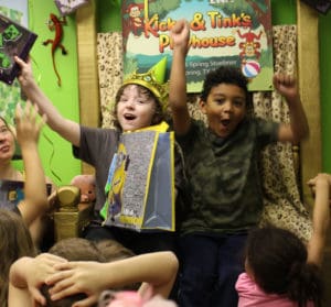 Birthday Party-goers sitting on the throne in the Kciky & Tink's party room